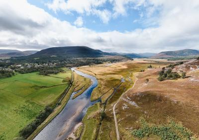 Aerial view of the River Dee and surrounding wetland, fields and mountains