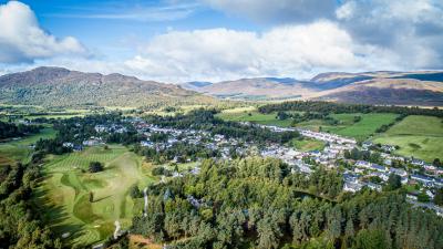 Aerial shot taken from above the Highland Folk Museum, looking towards Newtonmore.
